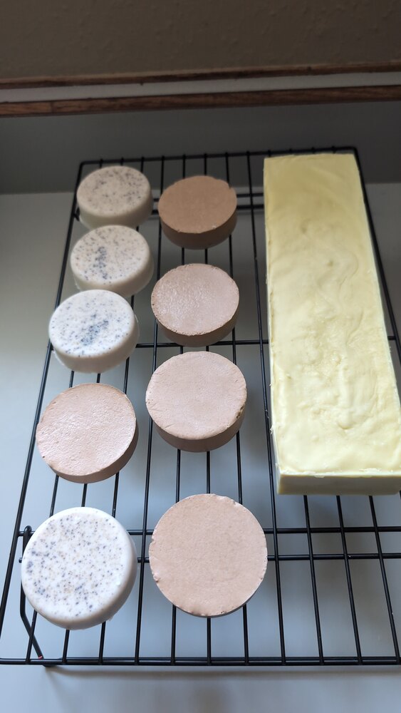 Fresh Castile-style soap batch resting on a curing rack