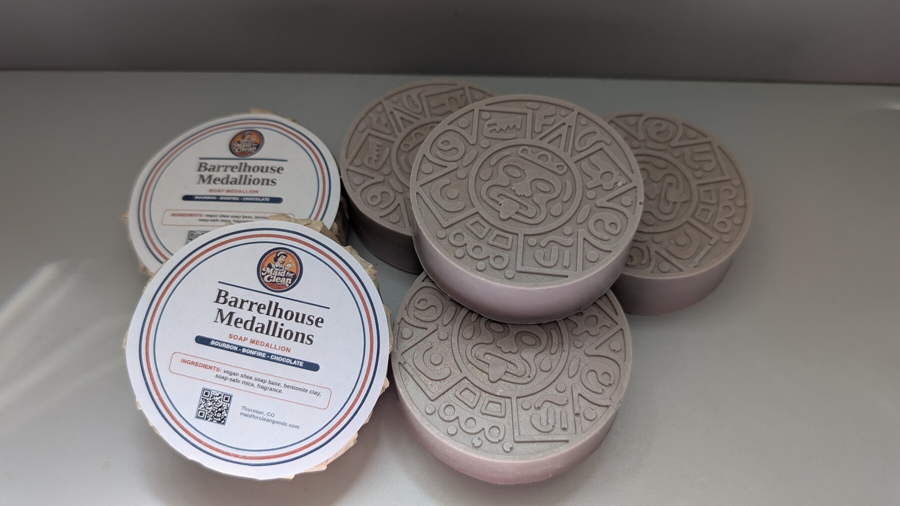 Barrelhouse Medallion soaps with detailed stamped faces and finished round Maid for Clean labels