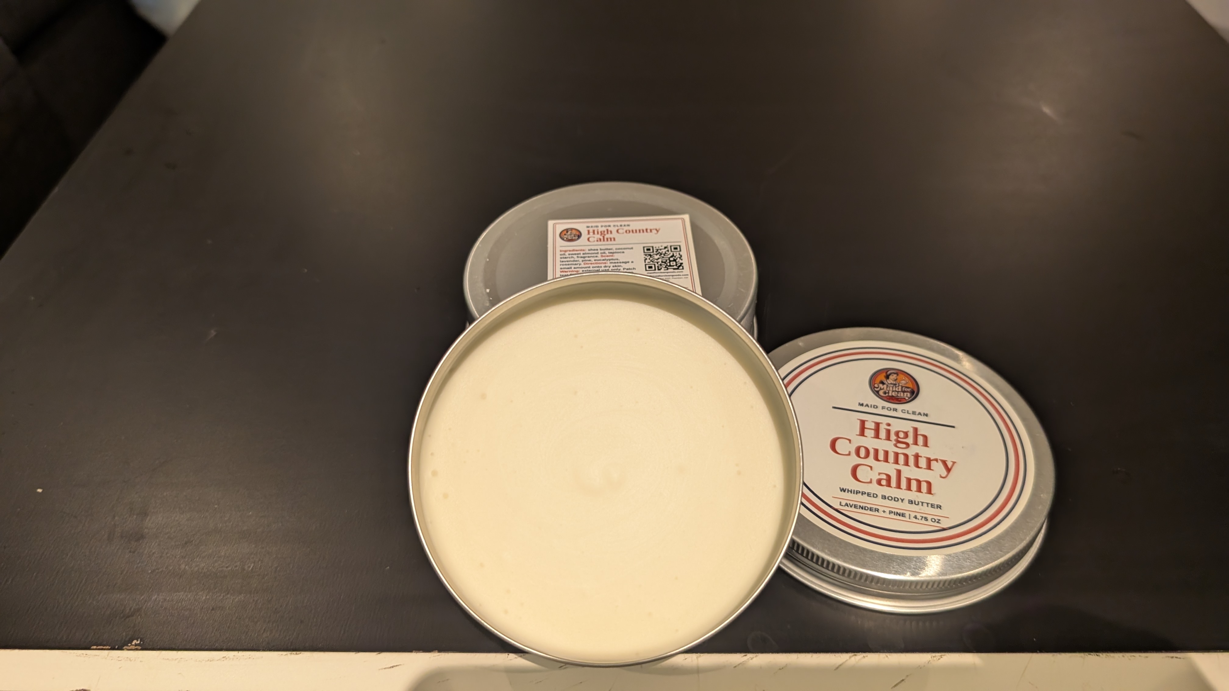 High Country Calm whipped body butter tins and open product