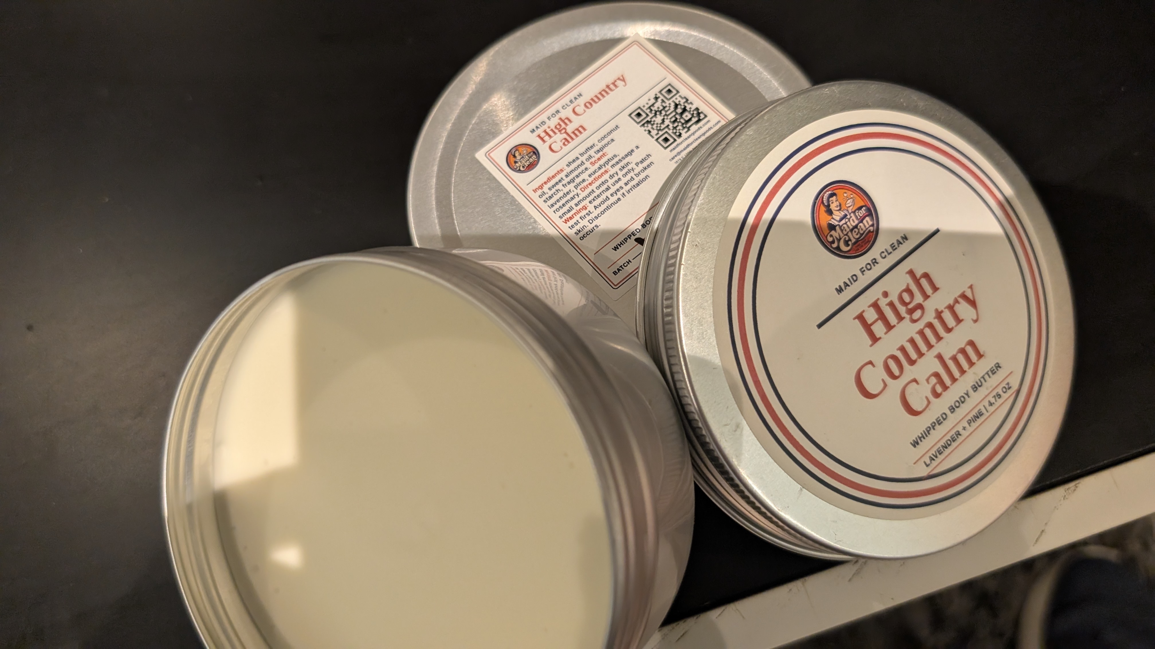 High Country Calm whipped body butter tins, label, and open product