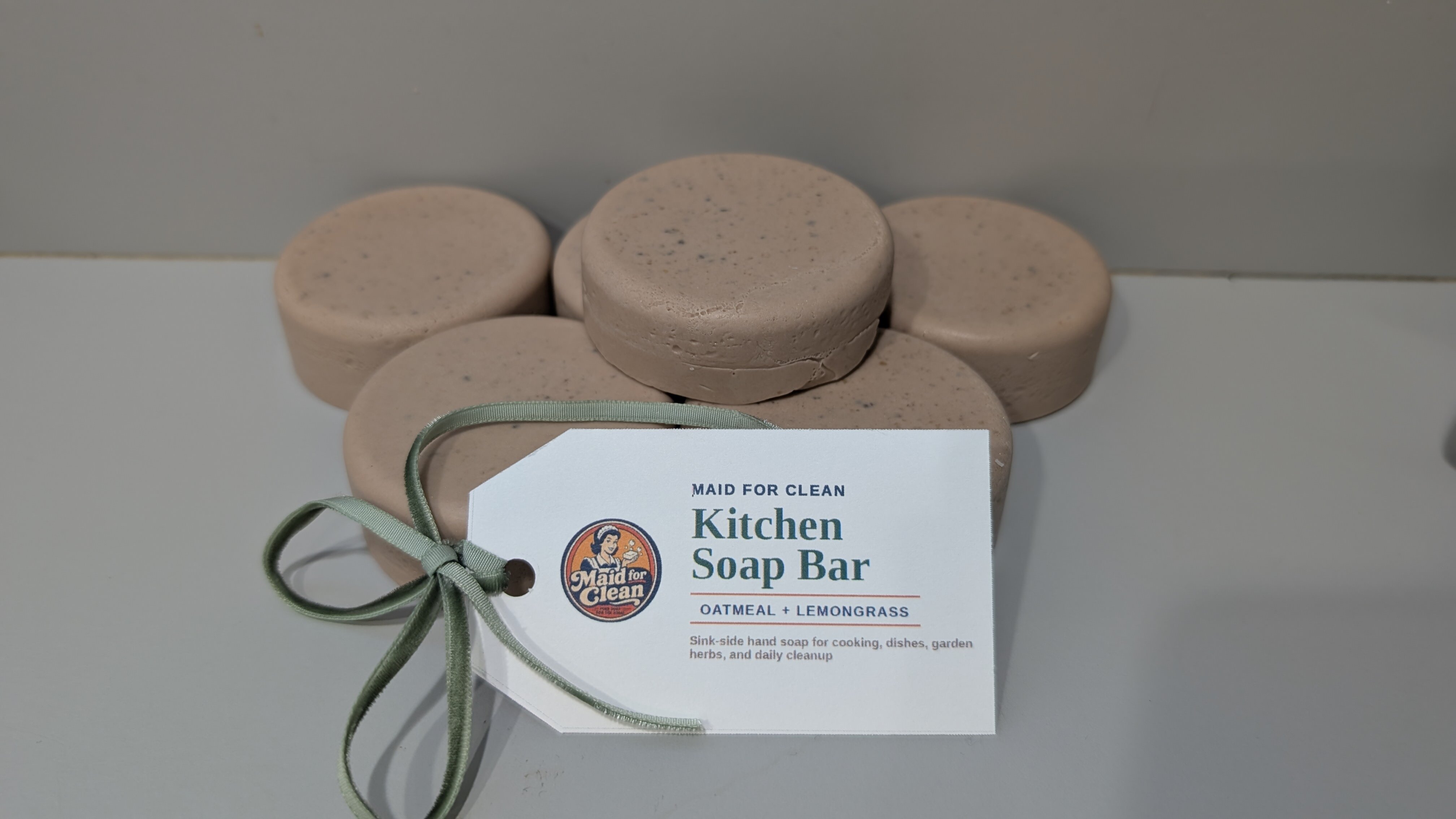 Five oatmeal and lemongrass Kitchen Soap bars displayed with their Maid for Clean hang tag