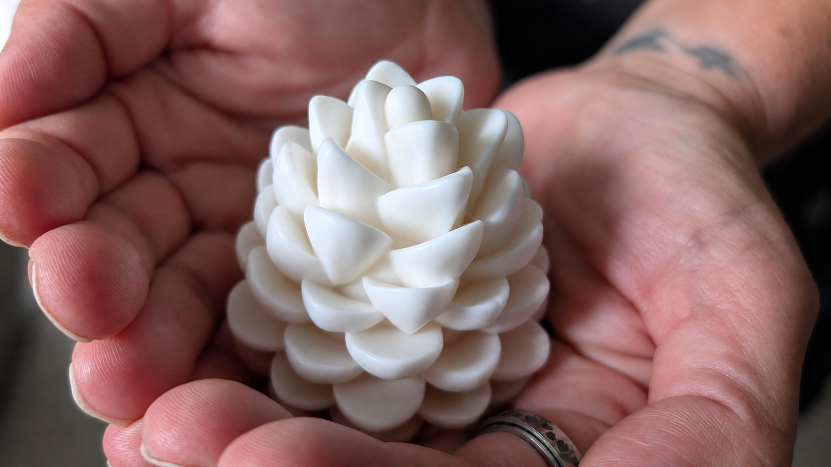 Maid for Clean pinecone-shaped soap held in hands