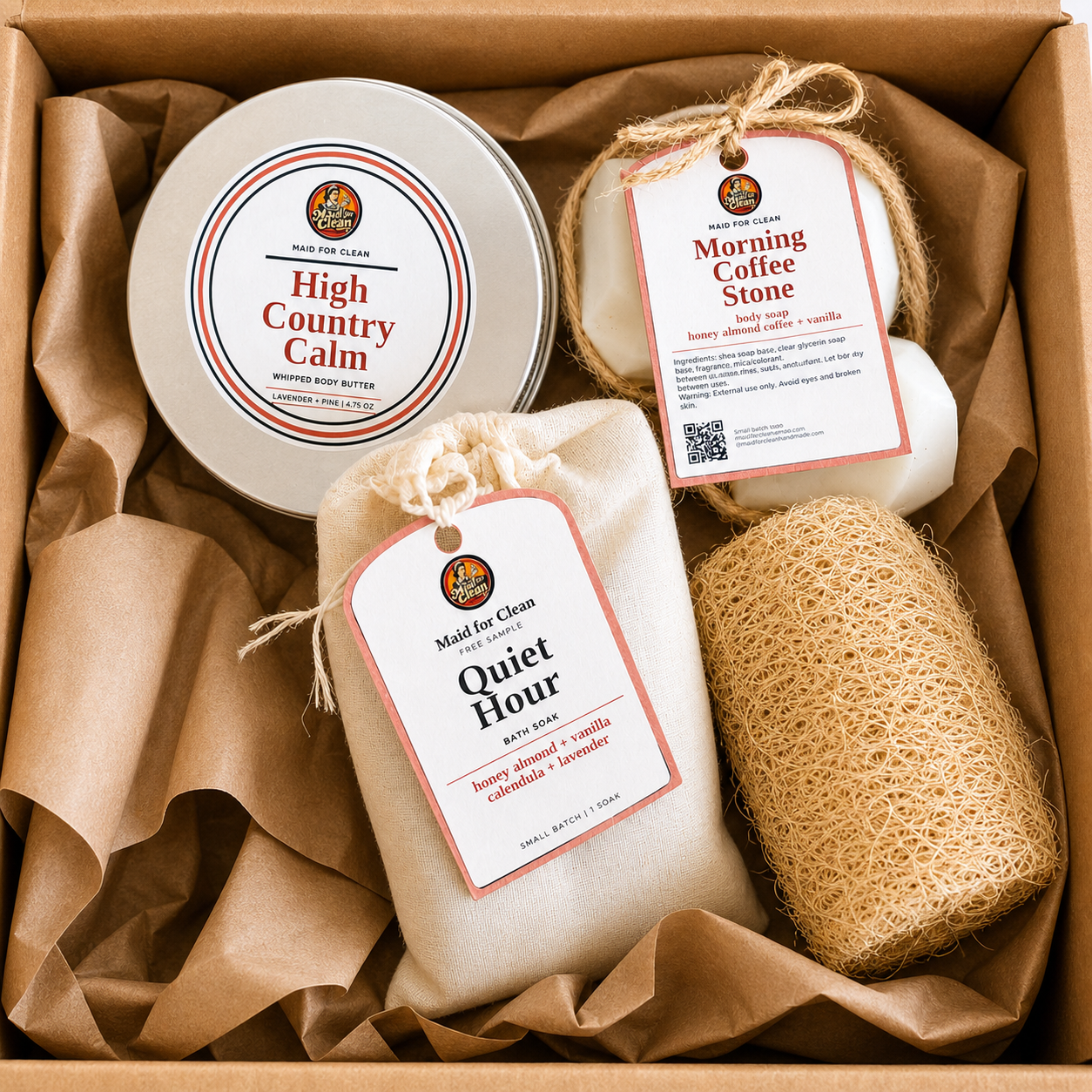Self-care bundle with body butter, bath soak, soap, and natural loofah in kraft gift box
