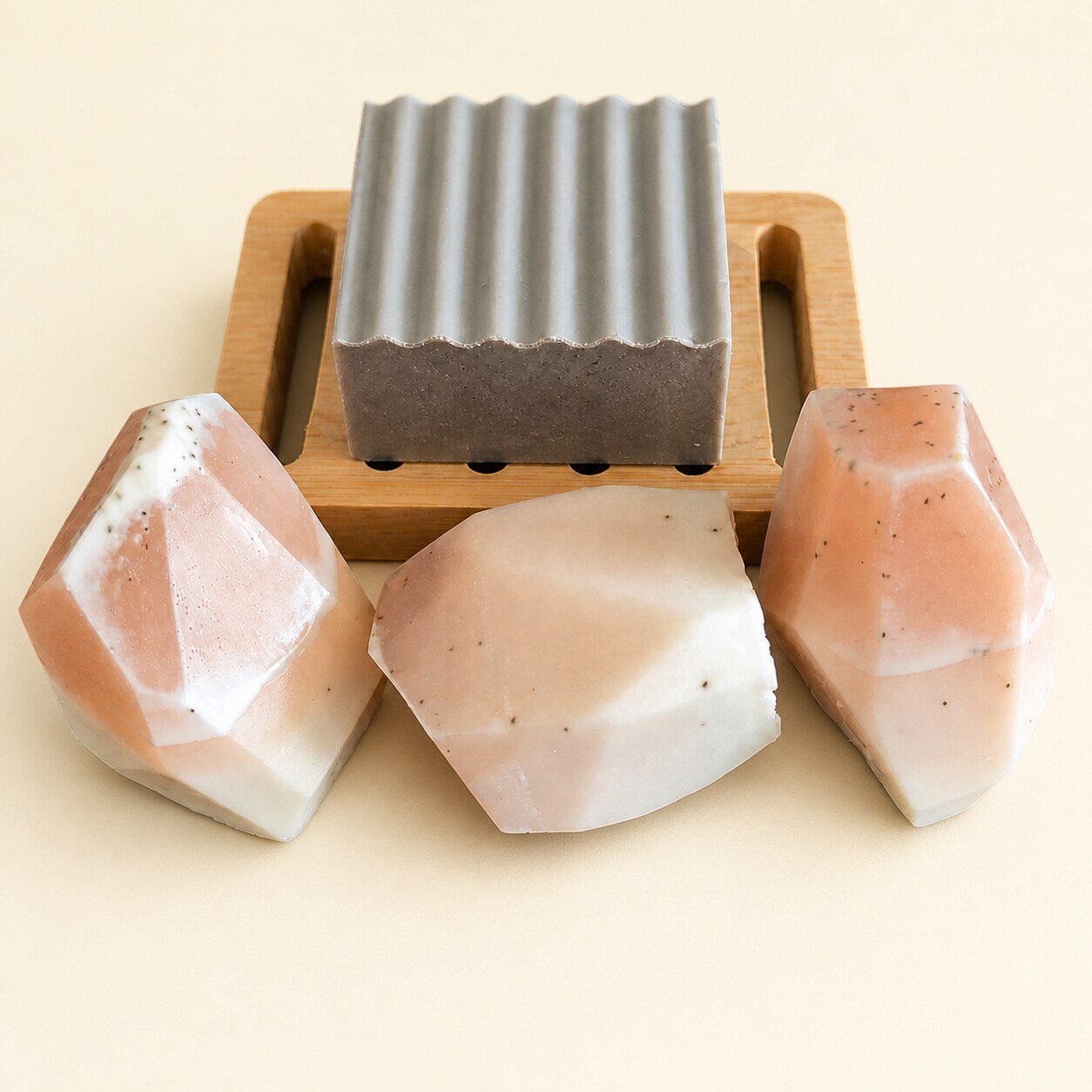 Sink-side soap set with handmade soap bars, rock soaps, and a wood soap saver dish