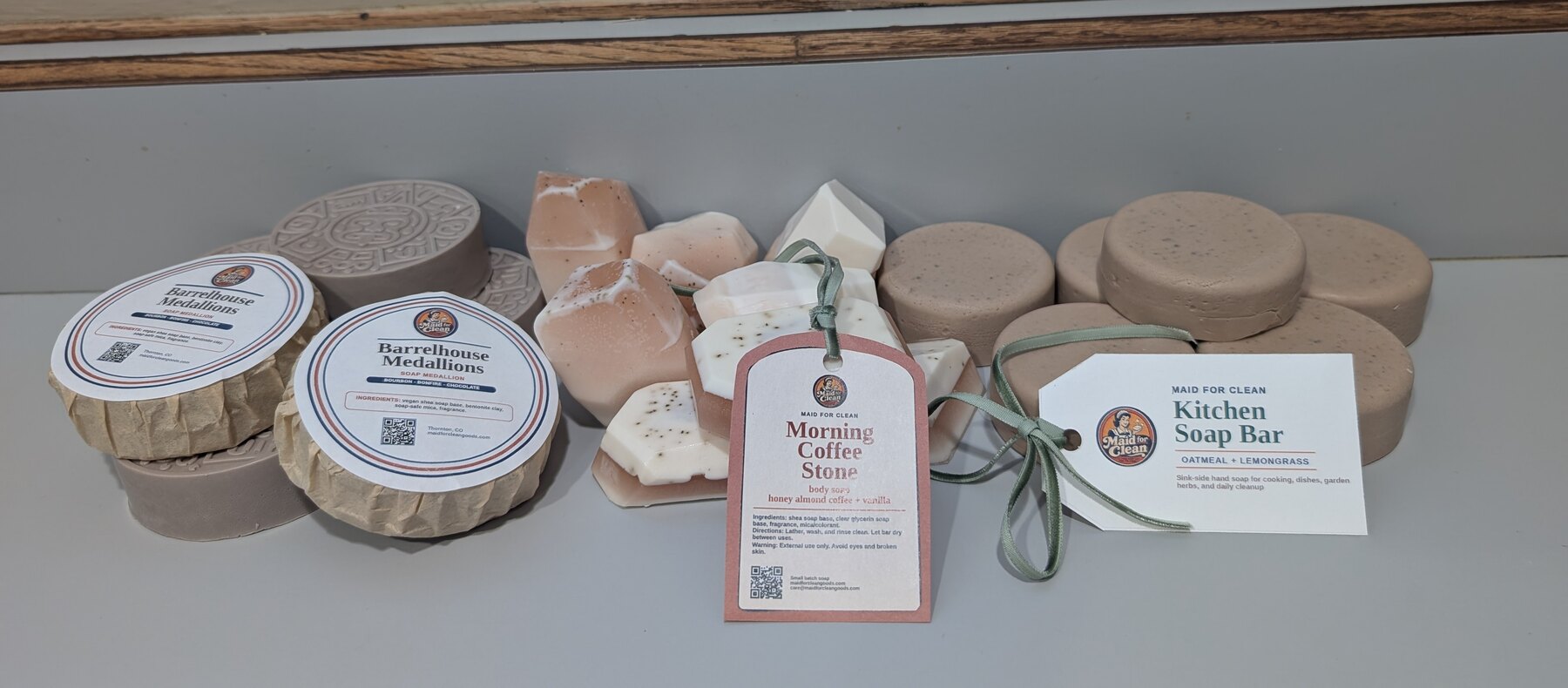 Maid for Clean soap collection featuring Barrelhouse Medallions, Morning Coffee Stone soaps, and oatmeal lemongrass Kitchen Soap bars