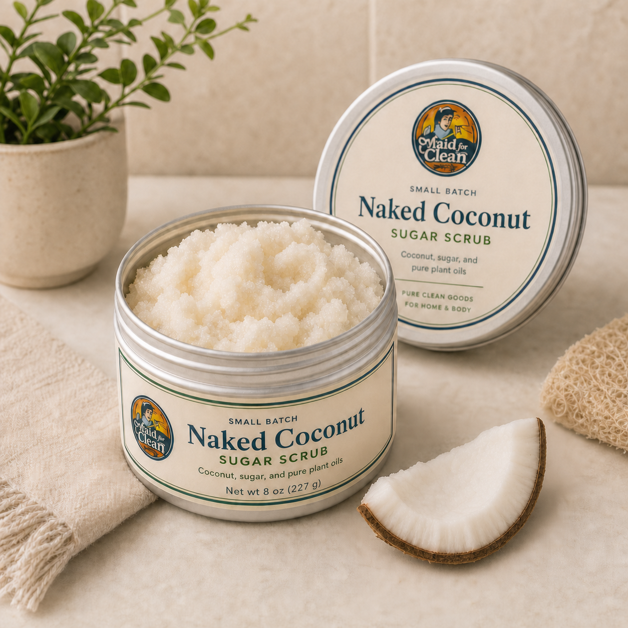 Sugar scrub in an 8 oz reusable tin with coconut slice